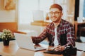 Portrait of Smiling Freelancer Working on Laptop