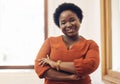 Portrait of smiling, friendly casual african american business woman leader, standing confident with arms crossed in Royalty Free Stock Photo