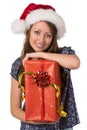 Portrait of smiling girl with big Christmas present. Royalty Free Stock Photo