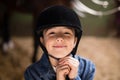 Portrait of smiling girl fastening helmet Royalty Free Stock Photo