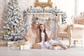 Portrait of smiling girl with grandmother with Christmas gifts Royalty Free Stock Photo