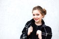 Portrait of a smiling girl in high key against white wall Royalty Free Stock Photo