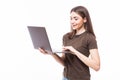 Portrait of a smiling girl holding laptop isolated on a white background and looking at camera Royalty Free Stock Photo