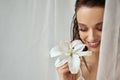 Portrait of smiling girl with lily flower. Royalty Free Stock Photo