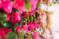 Portrait of smiling girl among purple bougainvillaea Royalty Free Stock Photo