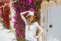 Portrait of smiling girl among purple bougainvillaea Royalty Free Stock Photo