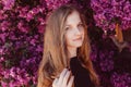 Portrait of smiling girl among purple bougainvillaea Royalty Free Stock Photo