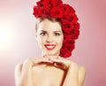 Portrait of smiling girl with red roses hairstyle Royalty Free Stock Photo