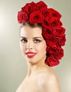 Portrait of smiling girl with red roses hairstyle Royalty Free Stock Photo