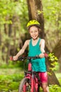 Portrait of smiling girl riding her mountain bike Royalty Free Stock Photo