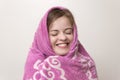 Portrait of smiling girl and wet hair wrapped in big towel. After shower or bath Royalty Free Stock Photo