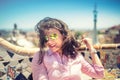 Portrait of smiling, gorgeous brunette girl with sunglasses on a windy day Royalty Free Stock Photo
