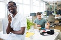 Portrait of smiling graphic designer standing with pen Royalty Free Stock Photo