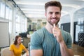 Portrait of smiling graphic designer standing with pen Royalty Free Stock Photo