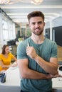 Portrait of smiling graphic designer standing with pen Royalty Free Stock Photo