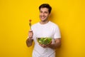 Portrait of Smiling Guy Holding Plate With Healthy Salad Royalty Free Stock Photo