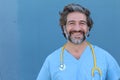 Portrait of a smiling handsome doctor with salt and pepper hair Royalty Free Stock Photo