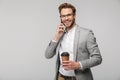 Portrait of smiling handsome man in eyeglasses talking on cellphone Royalty Free Stock Photo