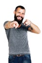 Portrait of smiling handsome Tattooed bearded man pointing Royalty Free Stock Photo