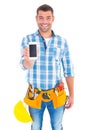 Portrait of smiling handyman showing mobile phone