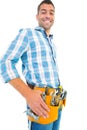 Portrait of smiling handyman wearing tool belt Royalty Free Stock Photo