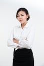 Portrait of smiling and happy asian businesswoman standing with arms folded and looking at camera dress in black suit isolated on Royalty Free Stock Photo
