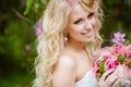 Portrait of a smiling happy bride blonde with pink bouquet Royalty Free Stock Photo