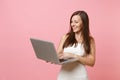 Portrait of smiling happy bride woman in wedding dress planning wedding, working on laptop pc computer isolated on Royalty Free Stock Photo