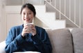 Portrait of smiling happy cheerful beautiful pretty asian woman relaxing drinking and looking at camara.Girl felling enjoy having Royalty Free Stock Photo