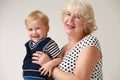Portrait of a smiling and happy grandmother and her grandson Royalty Free Stock Photo