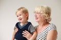 Portrait of a smiling and happy grandmother and her grandson Royalty Free Stock Photo