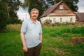 Portrait smiling happy old Elderly male having fun, walking in village near the house. Healthcare lifestyle senior man relax in