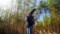 Portrait of smiling happy woman hiking in forest with outstretched hands . Concept of freedom and harmony with nature. Royalty Free Stock Photo