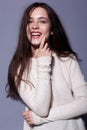 Portrait of smiling happy young brunette woman portrait in white Royalty Free Stock Photo