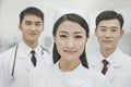 Portrait of Smiling Healthcare workers in China, Two Doctors and Nurse in Hospital, Looking At Camera Royalty Free Stock Photo