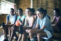 Portrait of smiling high school kids sitting on bench Royalty Free Stock Photo