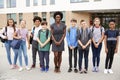 Portrait Of Smiling High School Student Group With Female Teacher Standing Outside School Buildings Royalty Free Stock Photo