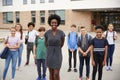 Portrait Of Smiling High School Student Group With Female Teacher Standing Outside School Buildings Royalty Free Stock Photo