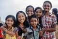 Portrait smiling indian children on Varkala during puja ceremony