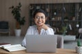 Portrait of smiling Indian woman work on laptop Royalty Free Stock Photo