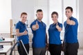 Janitors Showing Thumb Up Sign In The Office Royalty Free Stock Photo