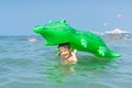 Portrait smiling little baby boy playing in the sea, ocean. Positive human emotions, feelings, joy. Funny cute child making vacati Royalty Free Stock Photo