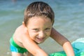 Portrait smiling little baby boy playing in the sea, ocean. Positive human emotions, feelings, joy. Funny cute child making vacati Royalty Free Stock Photo