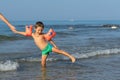 Portrait smiling little baby boy playing in the sea, ocean. Positive human emotions, feelings, joy. Funny cute child making vacati Royalty Free Stock Photo