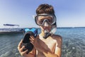 Smiling little boy with scuba mask and snorkel by the sea Royalty Free Stock Photo