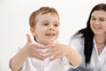 Portrait of smiling little child boy, having fun together with mother, talking. First communicating with world. Close up Royalty Free Stock Photo