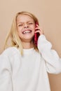 Portrait of a smiling little cutie communication smartphone entertainment kids lifestyle concept