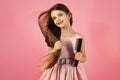 Portrait of smiling little girl brushing her hair Royalty Free Stock Photo