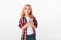 Portrait of a smiling little girl holding mobile phone Royalty Free Stock Photo