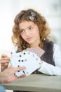 Portrait smiling little girl playing cards Royalty Free Stock Photo